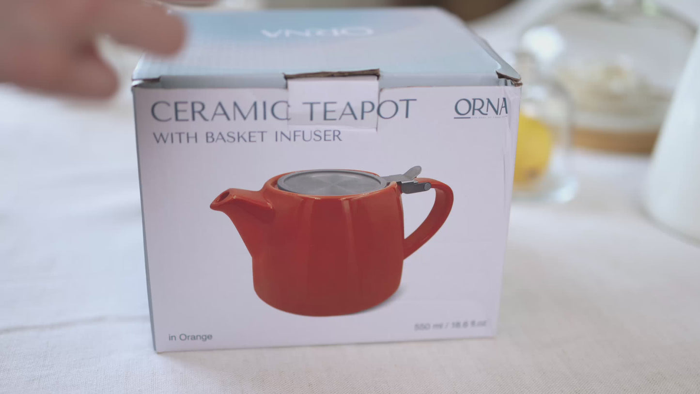 Load and play video in Gallery viewer, ORNA Ceramic Teapot with Basket Infuser and Stainless Steel Lid in Ocean, 18.6 Oz (550ml)